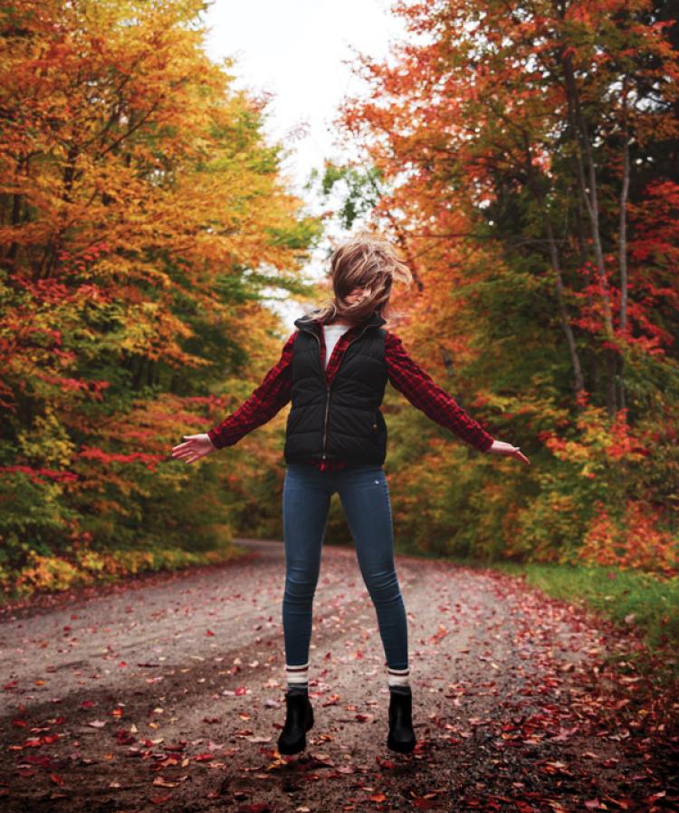 Woman in Autumn leaves